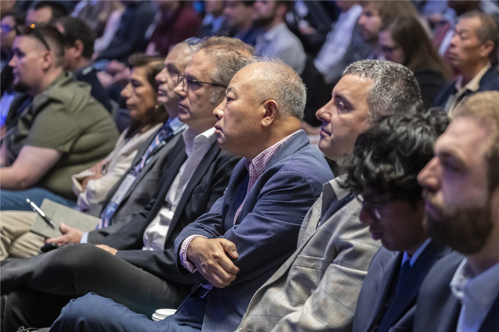 Conference audience listening during a plenary session