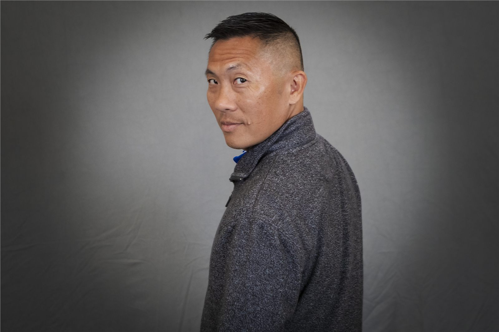 Professional environmental-style headshot of a man in profile