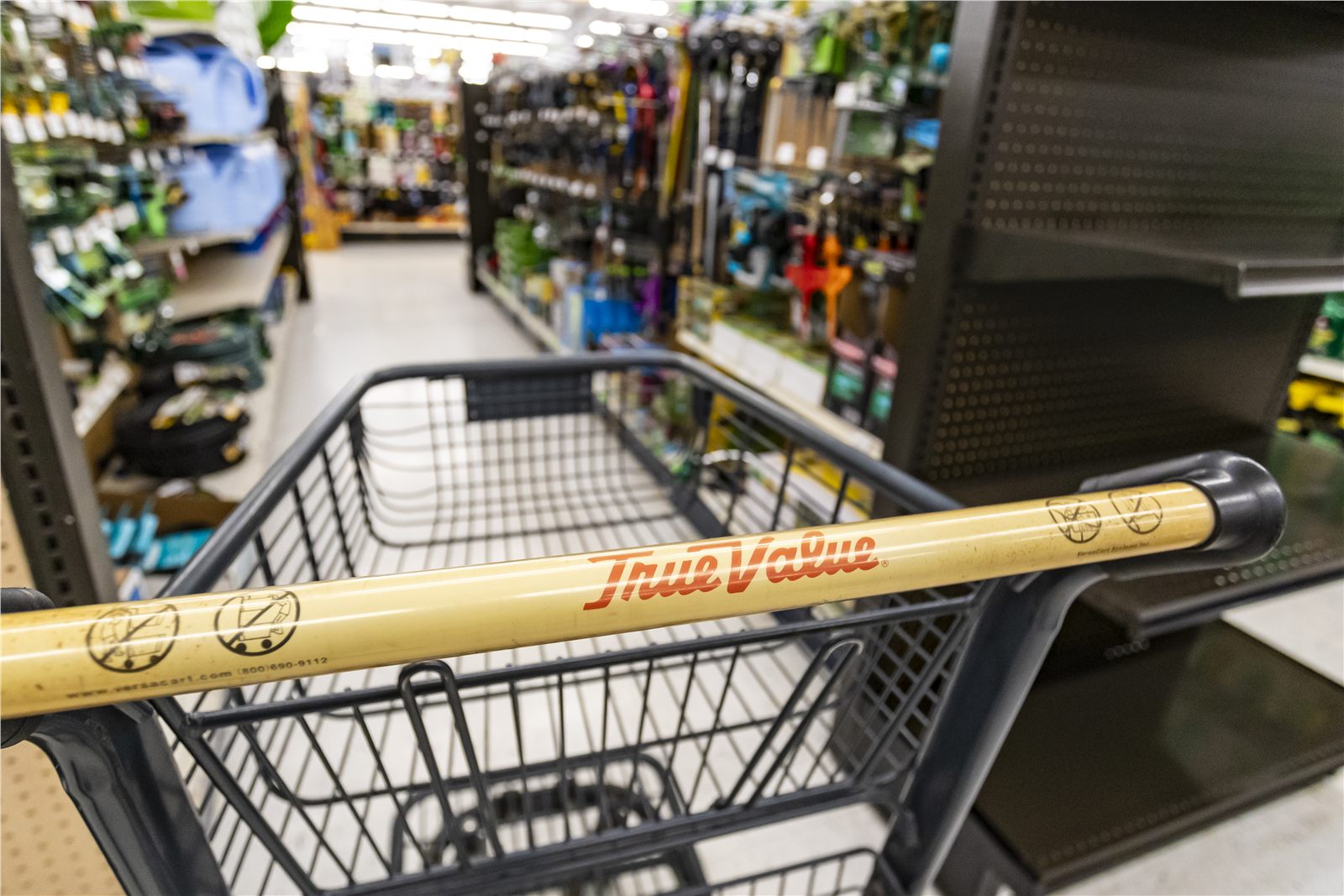 Branded shopping cart in a well-stocked independent retail store