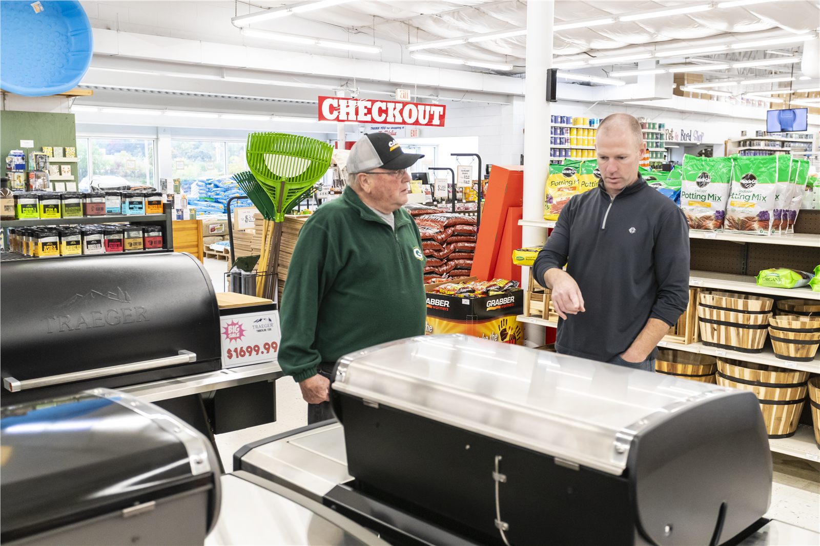 Customer and retail associate discussing a product on the sales floor
