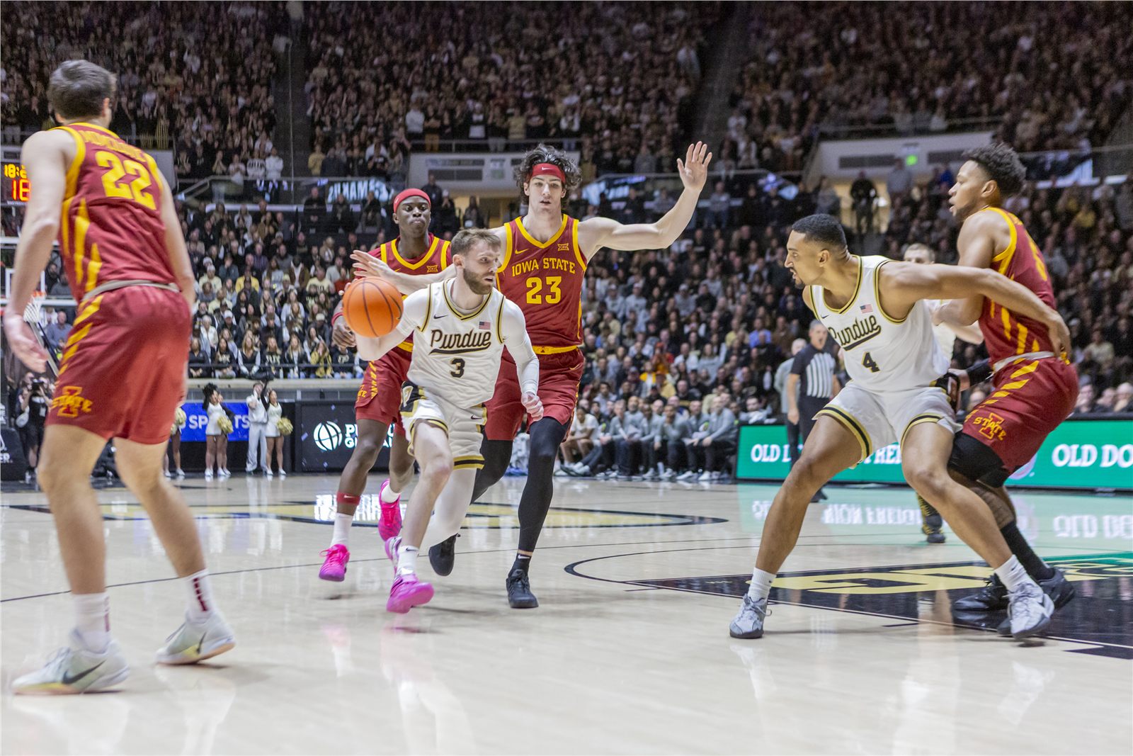 College basketball game action from courtside